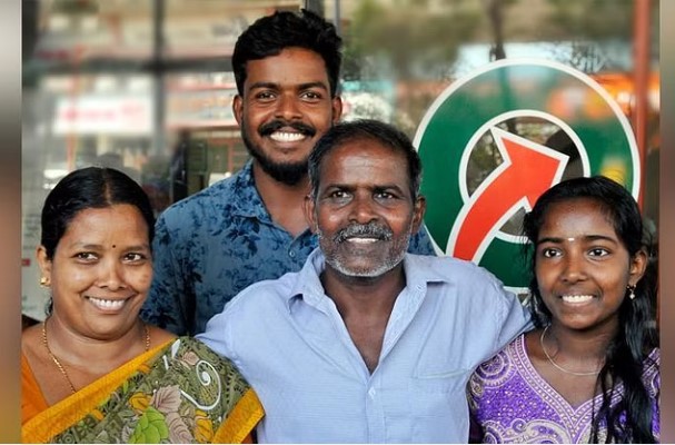 A photo of Porunnan Rajan with his family. He is a lottery winner.